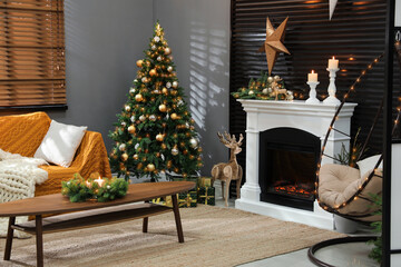 Beautiful living room interior with burning fireplace. Christmas celebration