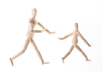 Family concept. Fatherhood. Spending time with children. Two puppet personified father and son are spending time together playing and fooling around