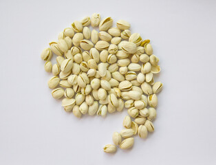 rest shape Pistachios isolated on white background, top view. 