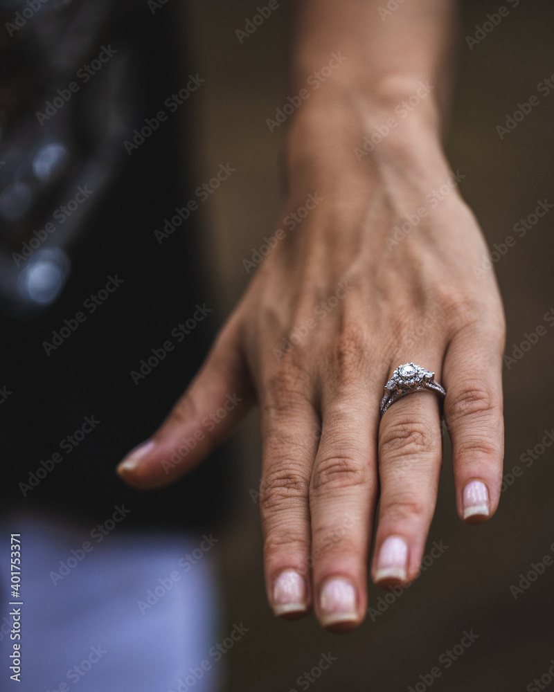 Wall mural a selective focus shot of a female's hand with an engagement ring