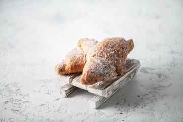 Croissants on a wooden sleigh