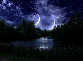 Obraz na płótnie Canvas Night sky and double moon on a fabulous cloudy sky