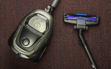 Vacuum cleaner on carpet. Top view. Cleaning concept.