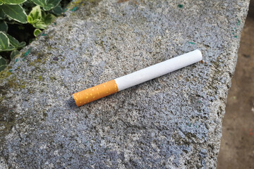 cigarette on conctere. Smoking concept. Unhealthy addiction