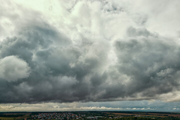 Deep blue rainy clouds and  some rays of light