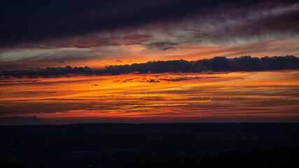 Deep blue rainy clouds and  some rays of light