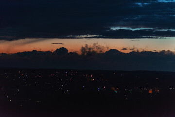 Deep blue rainy clouds and  some rays of light