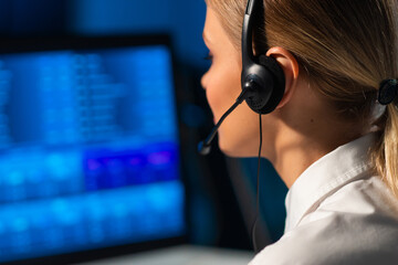 Female broker is workin in office using workstation and analysis technology. Workplace of...