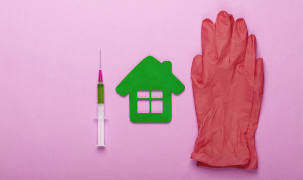 Blue Latex Gloves, Hospital Building Figurineand, Syringe On Pink Background. Vaccination. Top View