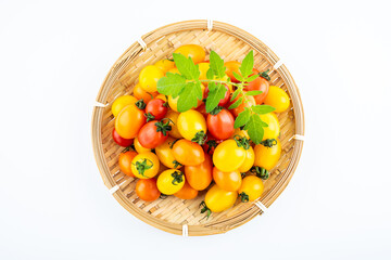 Fresh three-color cherry tomatoes on white background