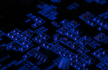 Computer microchips close-up. Digital technology. Blue light