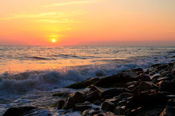 Subtropical sunset over sea. Tha Black sea seashore