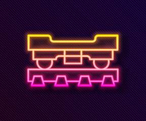 Glowing neon line Cargo train wagon icon isolated on black background. Freight car. Railroad transportation. Vector.