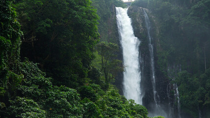 Aerial view of Waterfall in the jungle of the Philippines. Maria Cristina Falls in the tropical forest. Iligan City, Lanao del Norte.