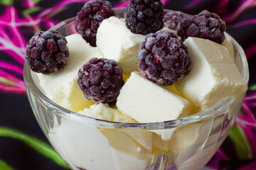 ice cream in a vase and berries on top