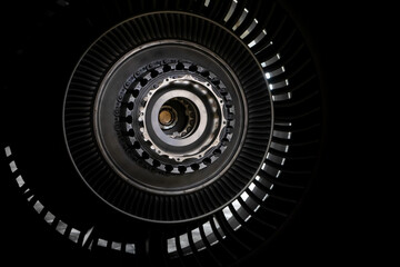 Details of the turboprop engine. Airplane propeller. Turbine mechanism and device. Screws, nuts, the inside of the device. Metallic background. Postcard for a mechanic engineer. Blade and blades.