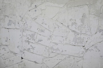  wall background. A gray and white stone wall, old cracked and worn.