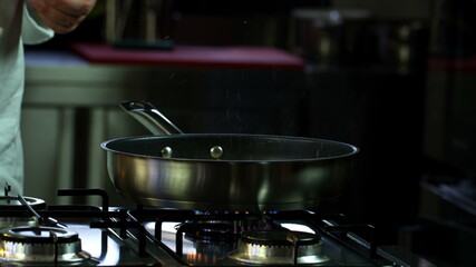 Adding Pepper. Close-Up Food. Cooking Process. Chef Cooking Dish. Chef Preparing Food photo still.