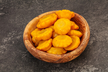 Marinated yellow patisson in the bowl