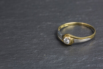 silver and golden ring with zirconia stone