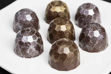 chocolate truffles with golden and silver shimmer