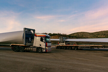 Special transport of blades for wind turbines, truck transporting a wind turbine blade that due to its large size requires a special adapted semi-trailer.