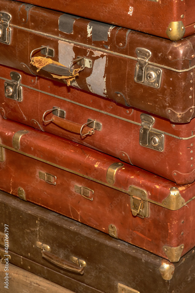 Poster stack of old retro suitcases close up