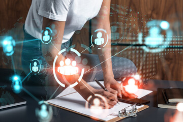 Businesswoman taking notes using smart-phone. Social media hologram double exposure. People network concept.