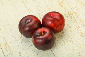 Ripe sweet plum fruit heap