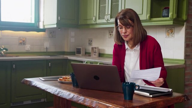 Woman working at home on laptop