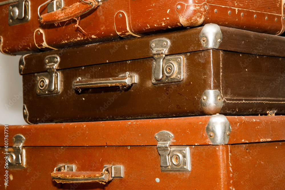 Poster stack of old retro suitcases close up