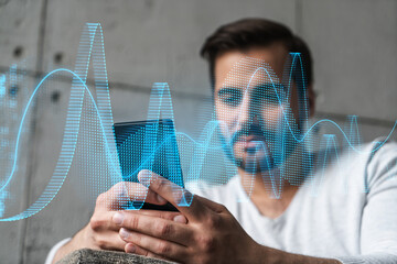 A man using smart phone. Double exposure. Math chart hologram. Financial trading on-line brokerage concept.