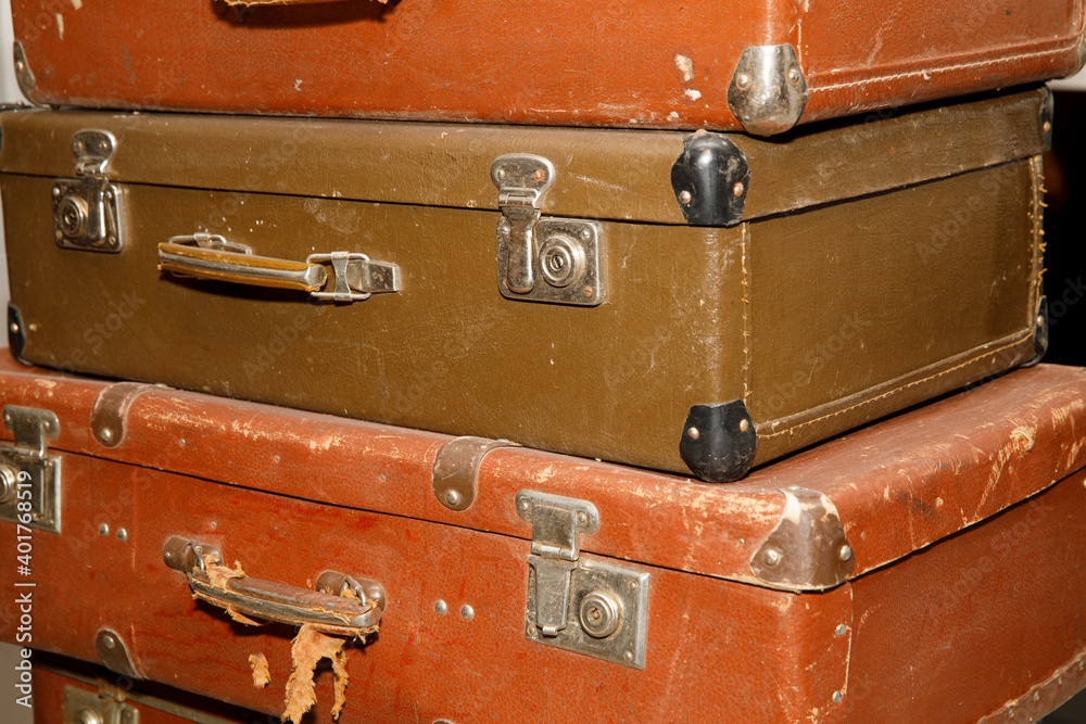 Poster stack of old retro suitcases close up