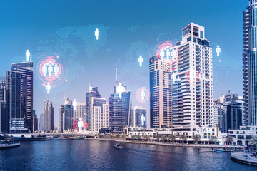 Fototapeta na wymiar Skyscrapers of Dubai business downtown. International hub of trading and financial services. Social network icons hologram, concept of people connection. Double exposure. Dubai Canal waterfront.