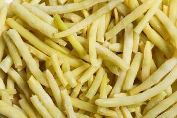 Frozen yellow string beans vegetable background.