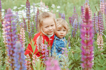 a child plays among the grass