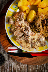 Stewed pork loin in a sauce with chanterelles.