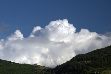 Fototapeta premium clouds over the mountains,sky, mountain, landscape, nature, blue,sky, mountain, landscape, nature, blue,landscape, nature,day, white, cloudscape,