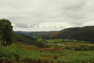 Fototapeta na wymiar A view down from the hills of Scotland to the glens, rivers and lochs below
