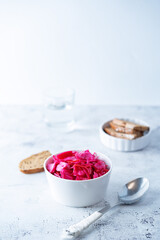 Fresh raw pickled beet cabbage with casrrot in a bowl