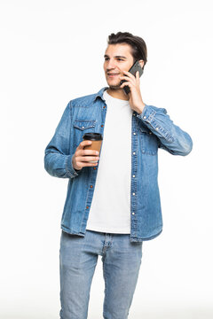 Portrait Of Happy Man Talking On Phone And Drinking Tea Or Coffee Isolated On White Backgorund