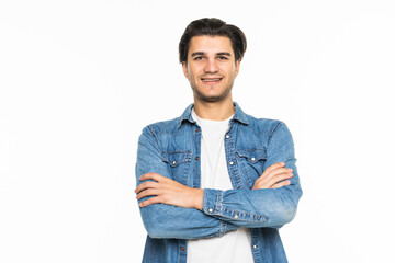 Young smiling man with crossed arms over white background