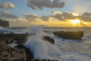 Fototapeta na wymiar Crushing waves during the sunset