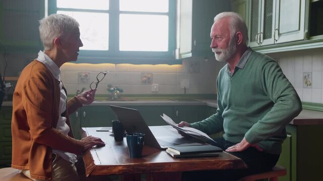 Senior couple having money problems at home