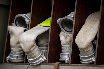 Rescue fire truck equipment. Compartment of the rolled up fire hoses on a fire engine