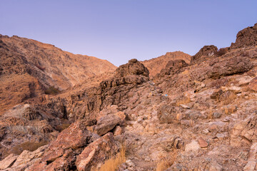 Barren mountain in Darband valley in dawn against purple sky in the Tochal mountain. A popular recreational region for Tehran's residents