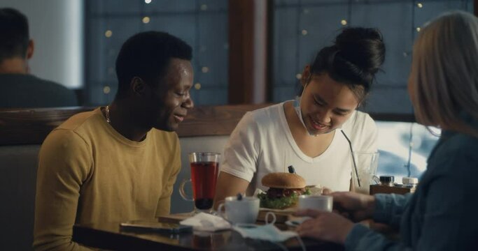 Black guy sharing feeling with friends in post pandemic times