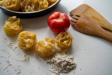 pasta and tomato sauce in white background