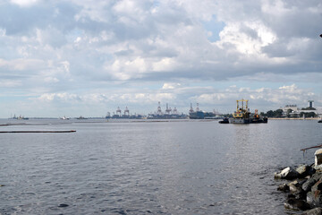 Obraz premium Offshore construction vessel anchored far from sea shore