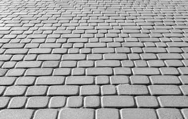 Fototapeta premium Gray stone paving stones as an abstract background.
